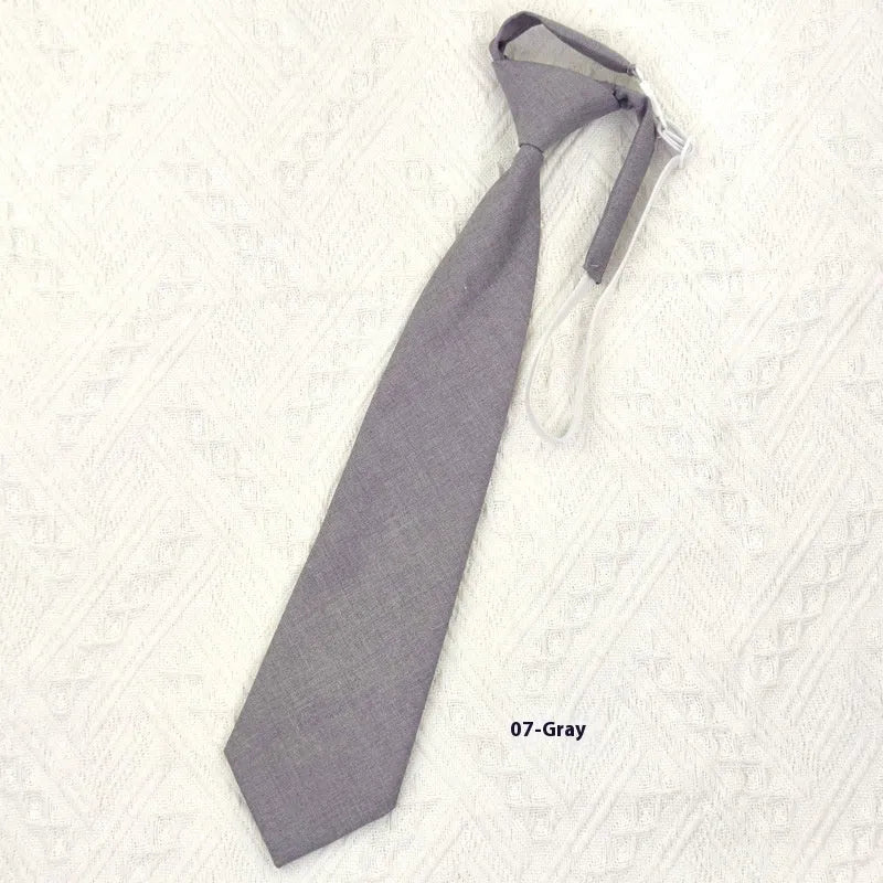 Men's navy blue cotton bow tie with arrow style shape on a white background.