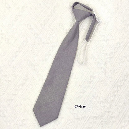 Men's navy blue cotton bow tie with arrow style shape on a white background.