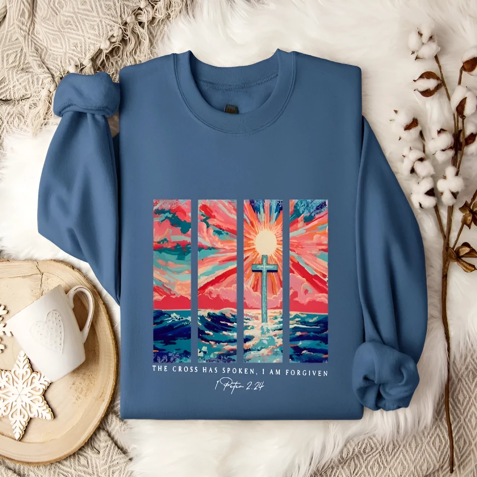 Blue plus size women's drop-shoulder printed polyester pullover sweater on a hanger.