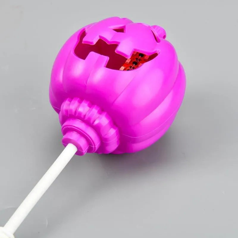 Plastic pumpkin decorative lamp with USB cable, available in purple or yellow light, measuring 22cm tall
