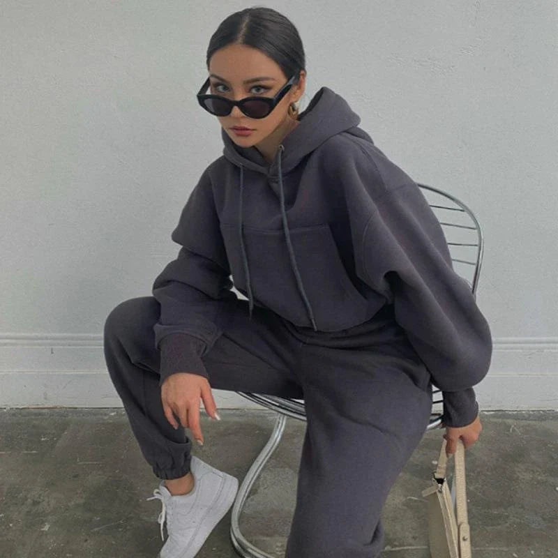 Women's casual hoodie outfit in various colors and sizes, featuring a stylish design and comfortable polyester construction.