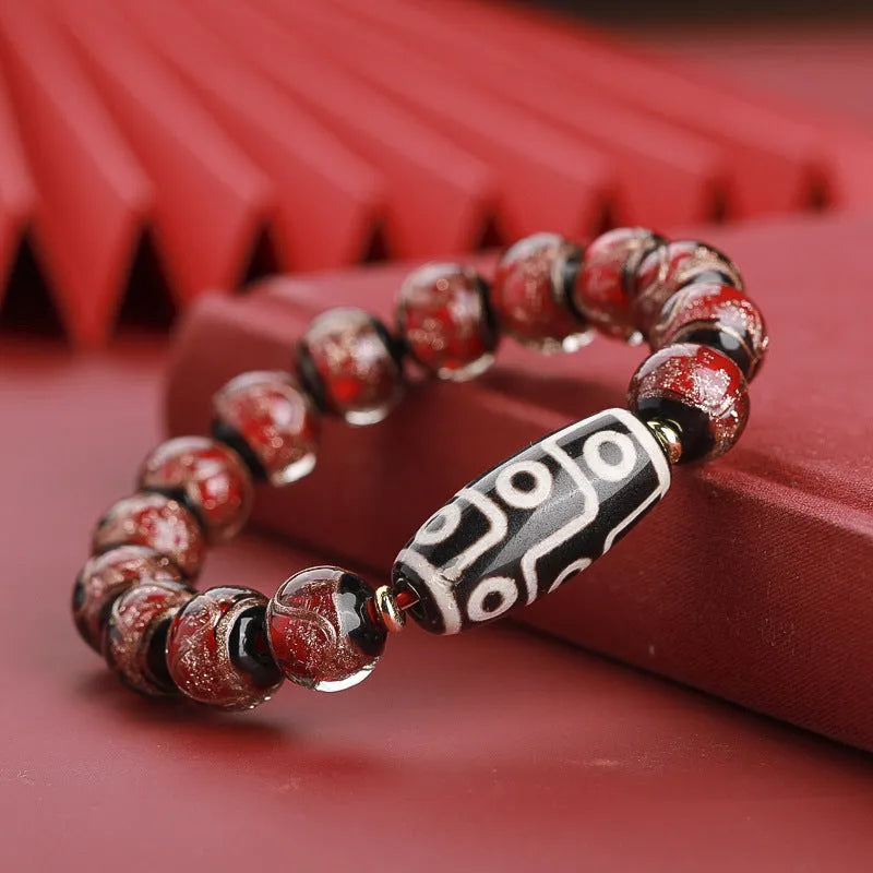Colourful Chinese-style coloured glaze bracelet with auspicious patterns and snake symbol on beads.