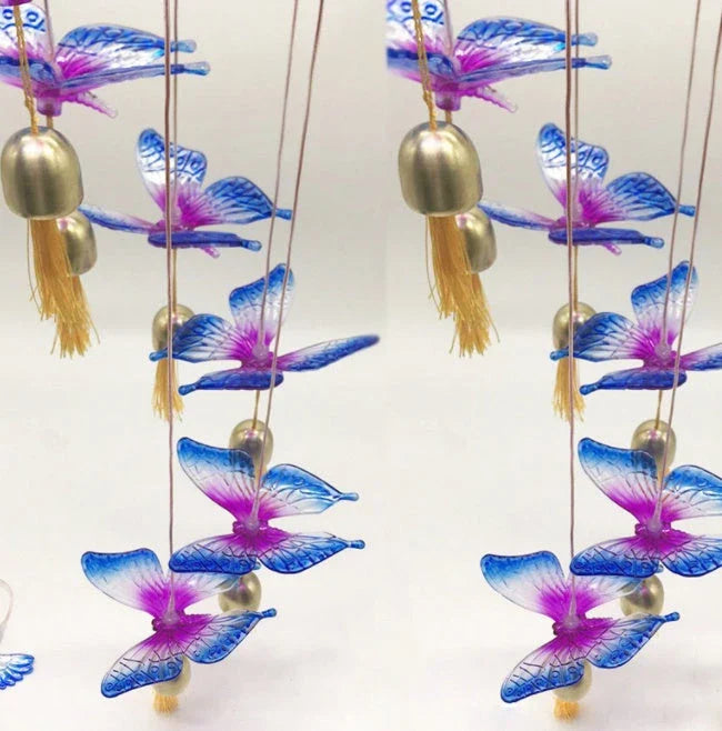 Vibrant solar-powered color changing wind chime with hummingbird and butterfly design for outdoor decor