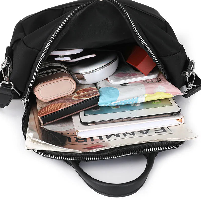Soft PU commute backpack in light pink colour showing mobile phone pocket and three-dimensional storage design