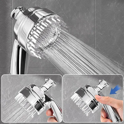 Silver dog shower attachment with silicone comb teeth and ergonomic grip for pet bathing.