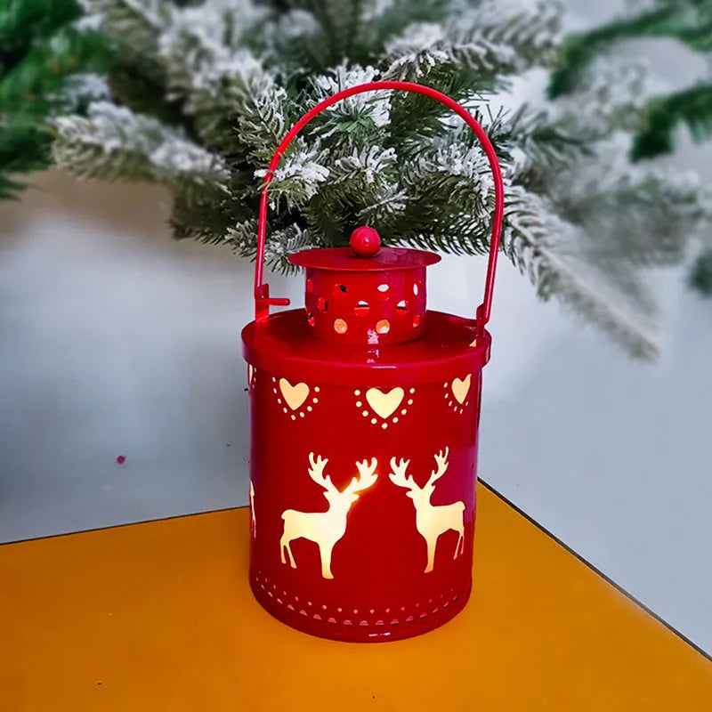 Green wrought iron electronic candle lantern with flickering LED light on a wooden mantel.
