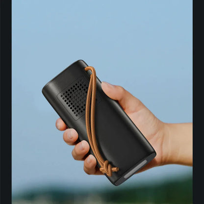 Black battery emergency power bank with solar panel, 70mm by 70mm by 162mm, showing 200W output and charging ports