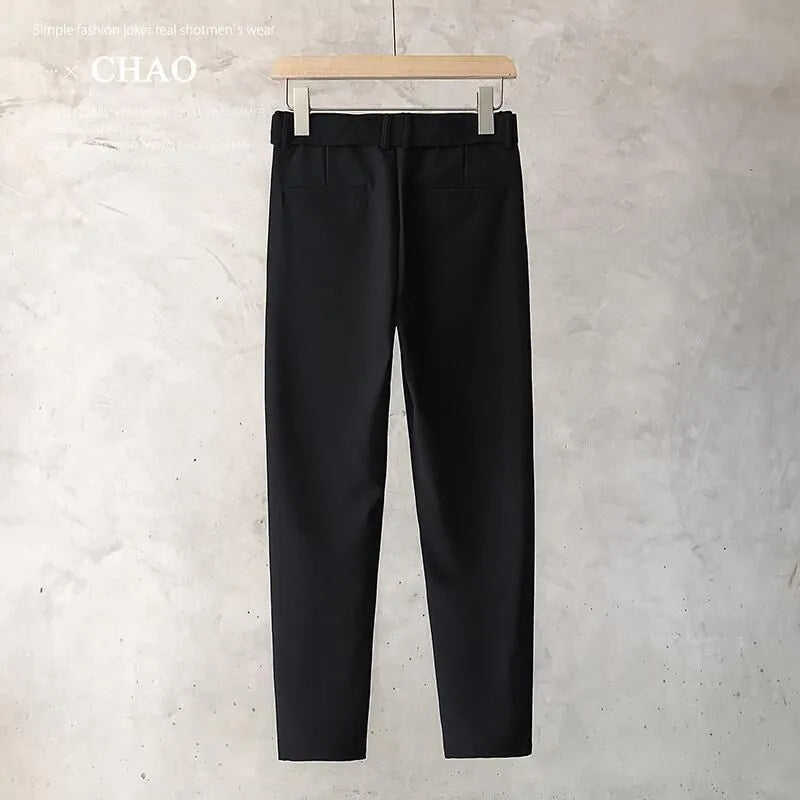 Boys slim straight wool trousers in a tapered fit, shown in a light grey colour.