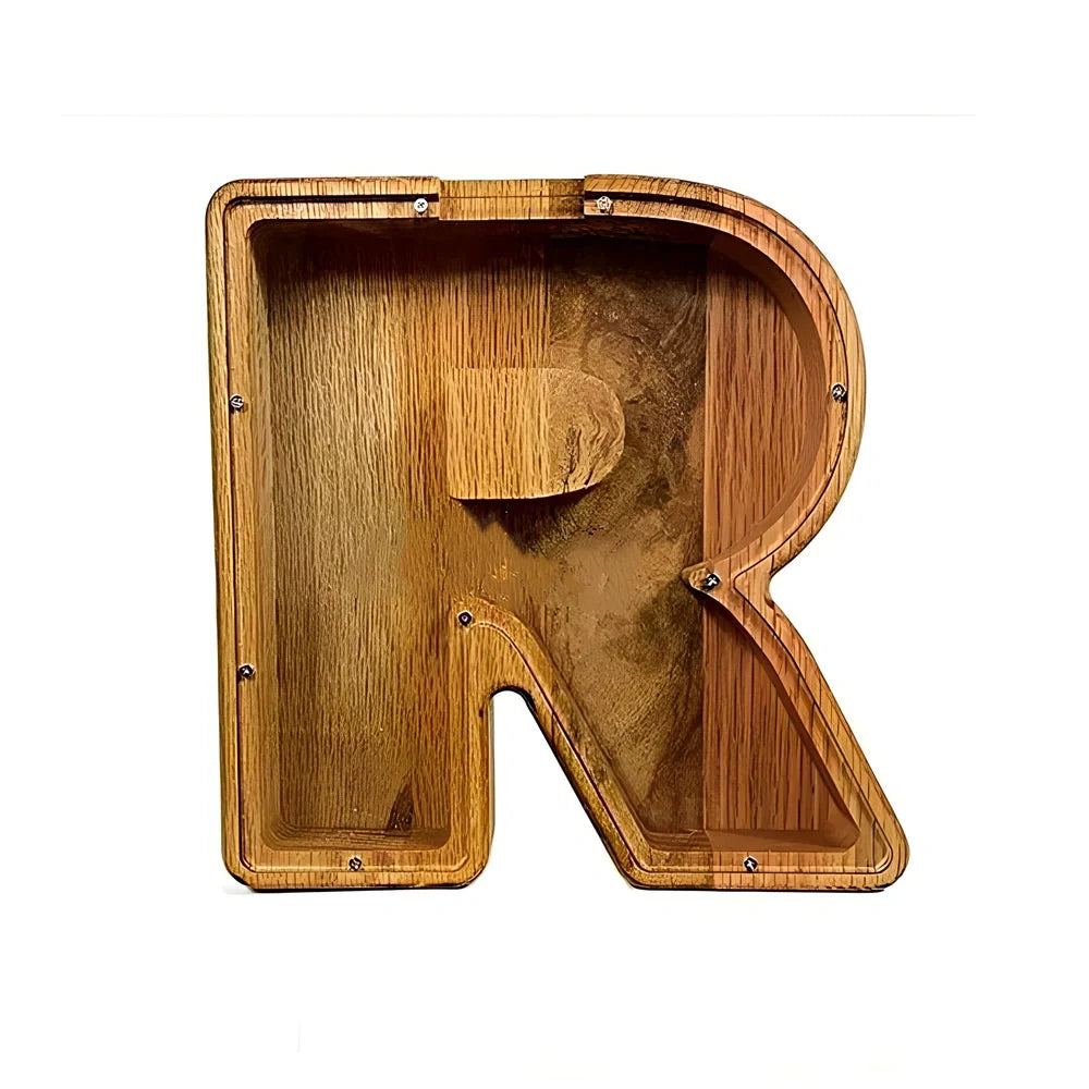 Handmade wooden letter piggy bank with personalised initial, showing 15cm height and 5cm coin slot for UK coins