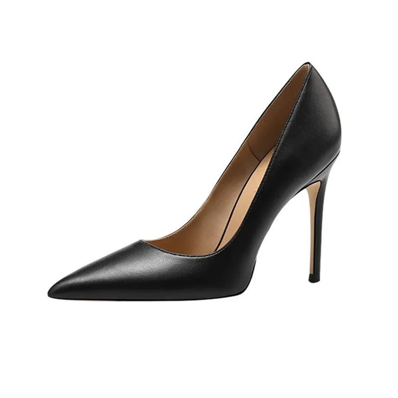 Black pointed toe stiletto high heel shoe with a low cut vamp on a white background.