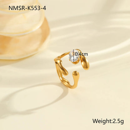 Geometric zircon ring showing round, oval and quadrangular design elements in stainless steel with electroplated finish