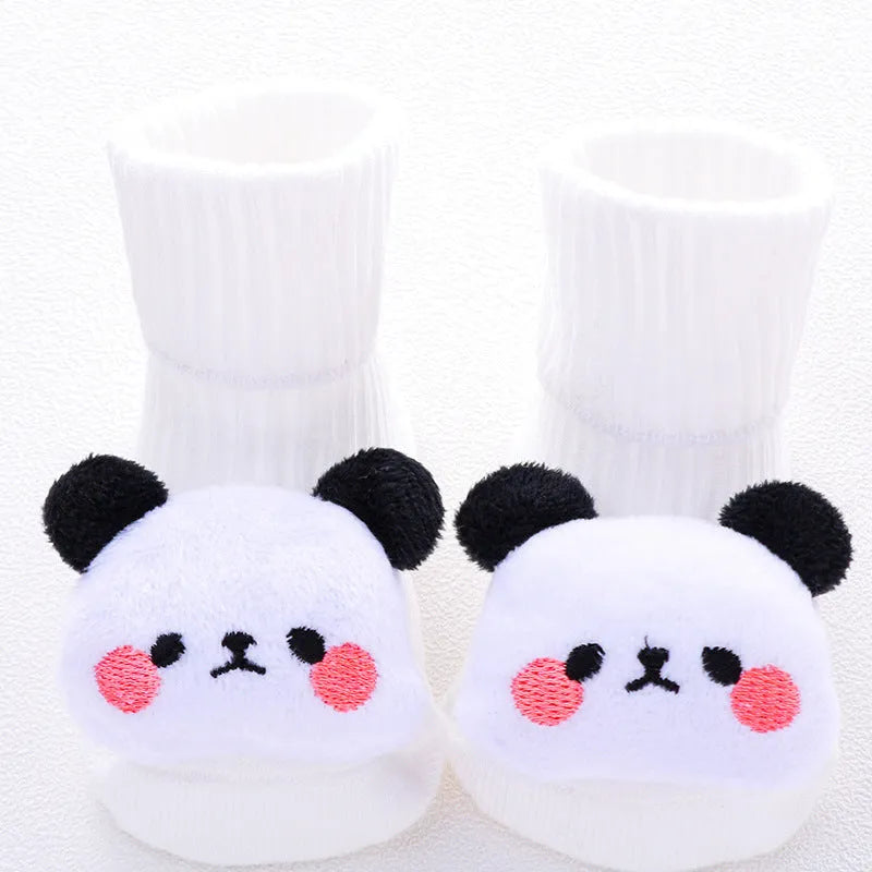 Cotton baby floor socks in assorted colours and patterns including bows, stars, and animal designs.