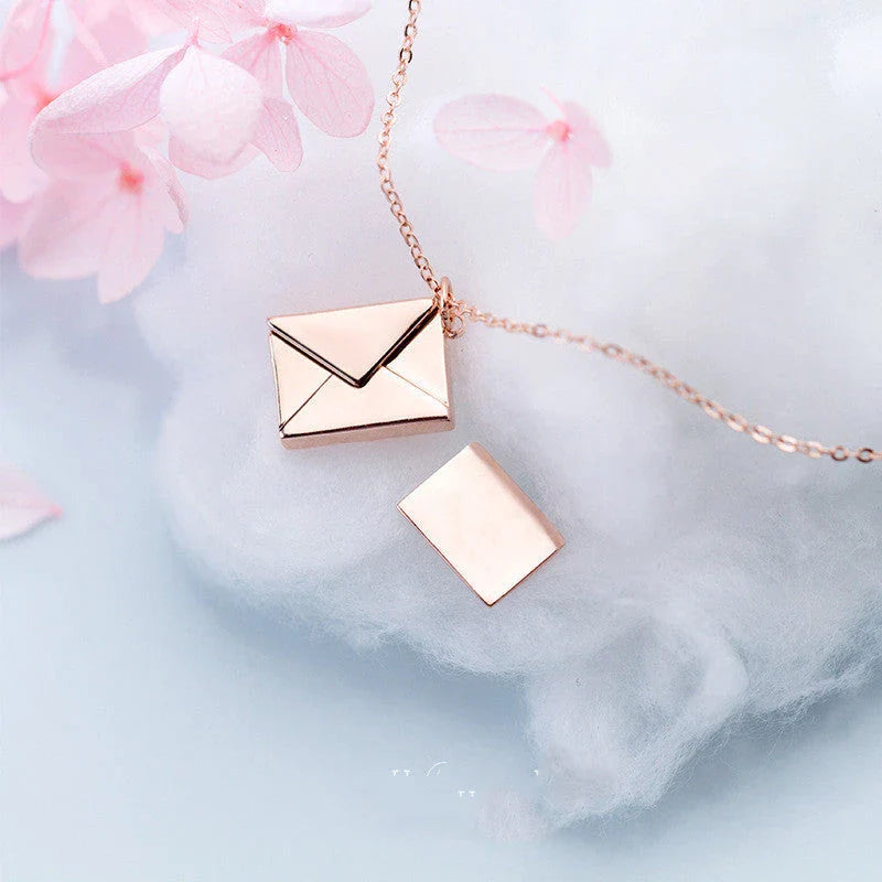 Stylish titanium steel envelope necklace with a discreet compartment for storing personal keepsakes