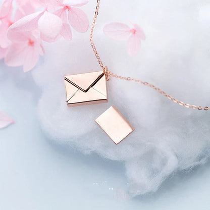 Stylish titanium steel envelope necklace with a discreet compartment for storing personal keepsakes