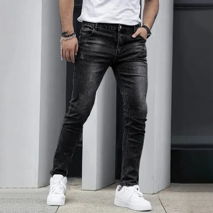 Men's black stretch jeans with straight leg skinny fit showing zipper fly and mid-rise waist