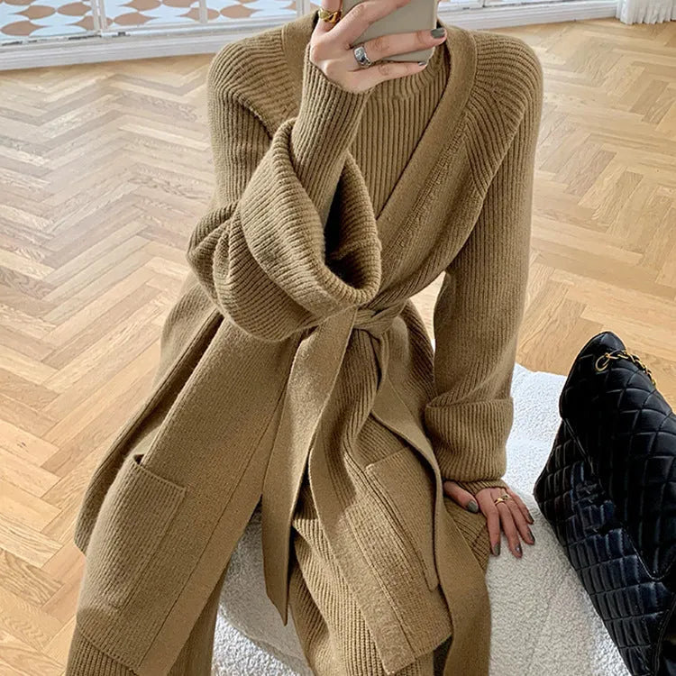 Women's knitted three-piece set with wide-leg trousers, cardigan, and top in solid colours, showing leather stitching details