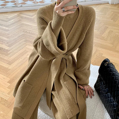 Women's knitted three-piece set with wide-leg trousers, cardigan, and top in solid colours, showing leather stitching details