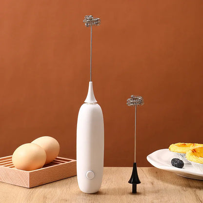 Hand-held electric milk frother in black or white colour, modern design for frothing and blending beverages