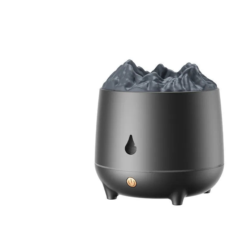 White volcano-shaped humidifier with USB cable on a wooden table, emitting mist.