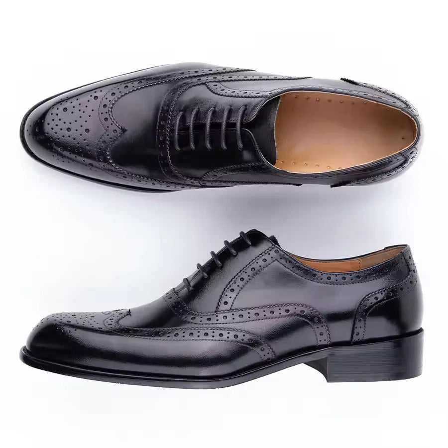 Men's purple leather Oxford shoes with hand-carved design and pointed toe on a rubber sole.
