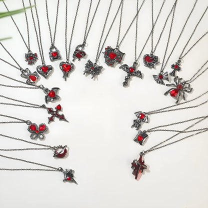 Gothic style zinc alloy necklace with bat pendant on a silver chain against dark background.