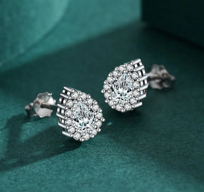 A pair of women's silver drop-shaped ear studs with a polished finish on a white background.