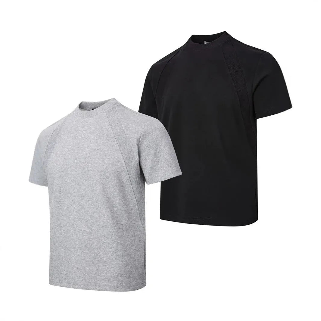 Man's loose fit black short sleeve top with textured air layer stitching detail.