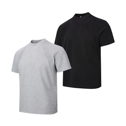 Man's loose fit black short sleeve top with textured air layer stitching detail.