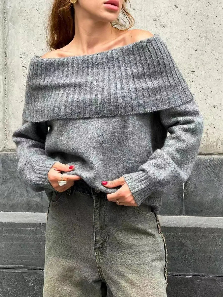Grey off-shoulder acrylic sweater with 3D pattern texture, showing strapless design and regular sleeves