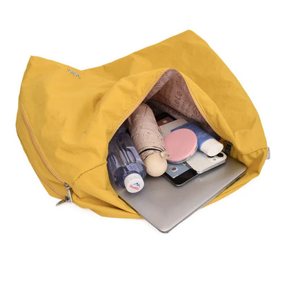 Heart-shaped soft nylon underarm shoulder bag for women in black, blue, khaki, or yellow.