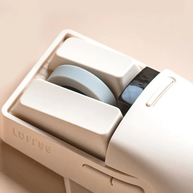 Xiaoqiao wireless mouse in tofu colour with ergonomic shape and four-way roller on desk