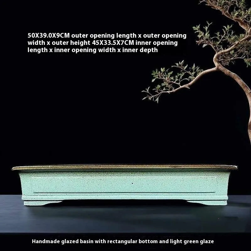 Green ceramic bonsai pot with purple sand crackled glaze finish, 15cm diameter plant container on wooden surface