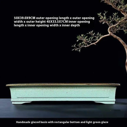 Green ceramic bonsai pot with purple sand crackled glaze finish, 15cm diameter plant container on wooden surface