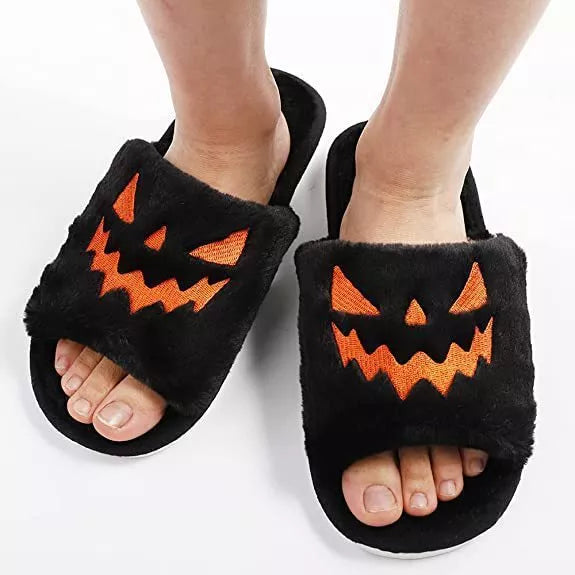 Women's Halloween winter slippers with rabbit fur uppers and PU soles in purple, black, pink, or orange.