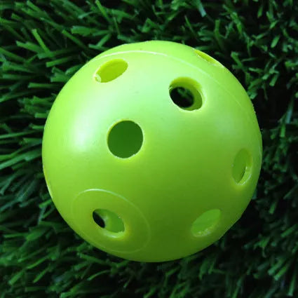 Hollow plastic golf practice balls in various colors for indoor use