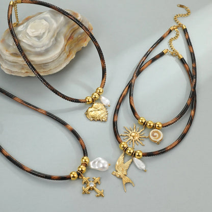 Geometric leopard print pendant on a stainless steel chain necklace for women.
