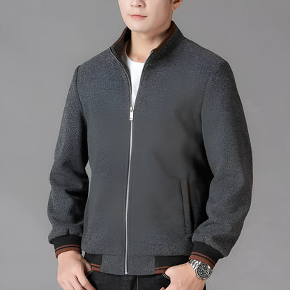 Men's grey sports-style fleece coat with long sleeves and a chest pocket on a hanger.