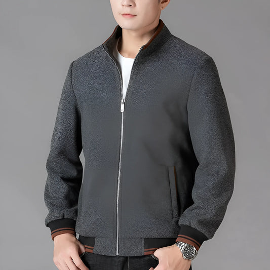 Men's grey sports-style fleece coat with long sleeves and a chest pocket on a hanger.
