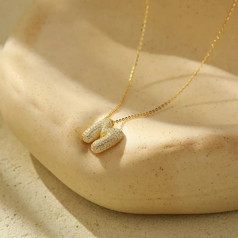 Stainless steel initial pendant necklace with zircon accents, personalized with your choice of letter.