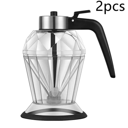 Diamond-shaped glass oil jug with press-type dispenser for drip-free pouring