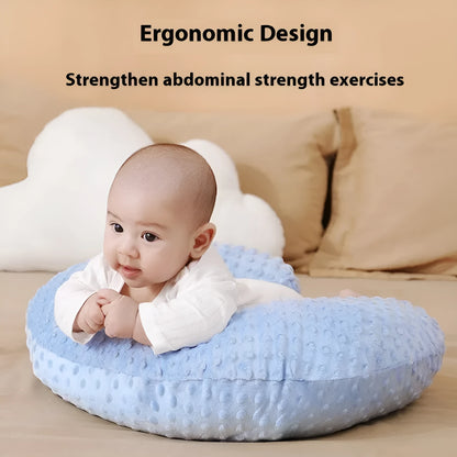 Nursing pillow with integrated 15cm raised barrier to prevent milk spills during breastfeeding, shown with removable pillowcase