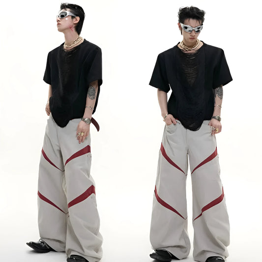 Men's loose fit black t-shirt with a hollow-out V-neck collar and tassel detail on short sleeves.