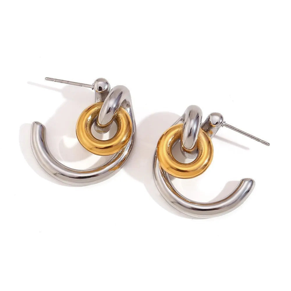 Gold electroplated stainless steel earrings, necklace, and bracelet set with geometric shapes and round ring elements