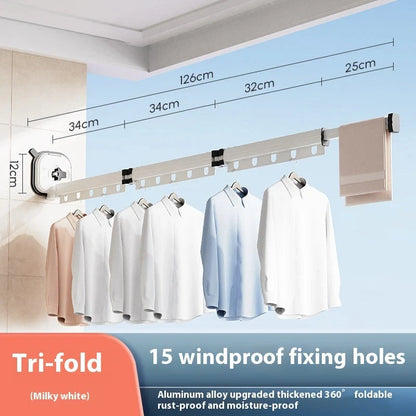 Aluminum retractable drying rack mounted on a window, extending outward for clothes drying