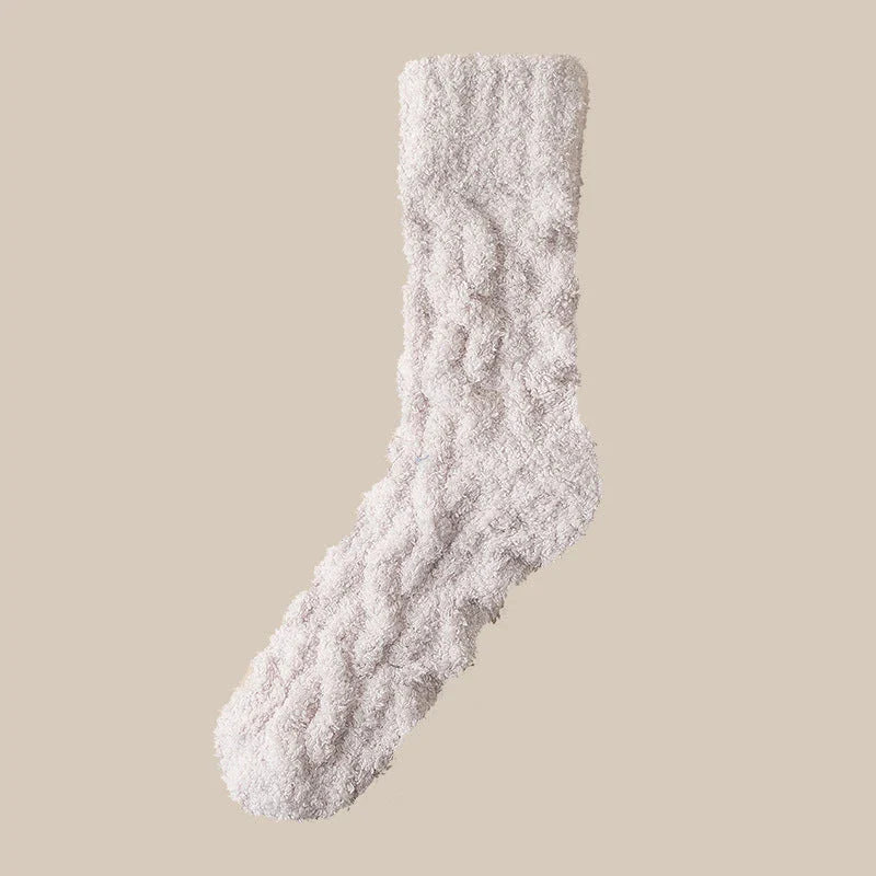 Cozy coral fleece socks in various colors, designed for superior comfort and warmth