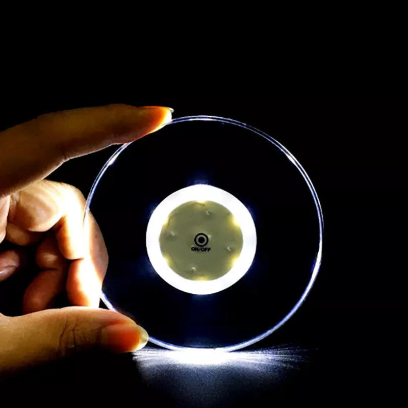 LED Glow Coaster with vibrant colors illuminating a cocktail glass