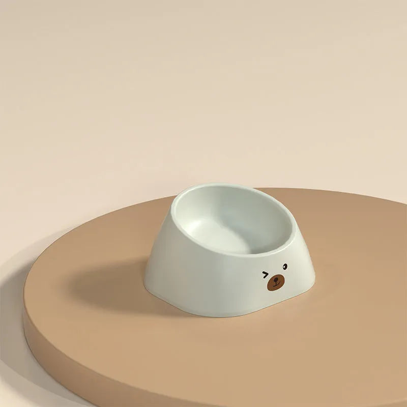 Green tilted stainless steel pet bowl with a 15-degree angle on a white background.