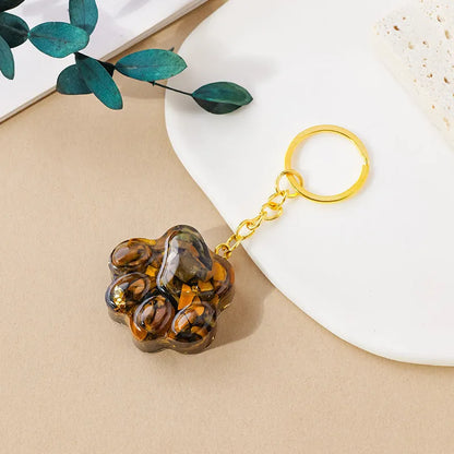 Natural crystal cat's paw keychain pendant showing gemstone options with integrated attachment loop