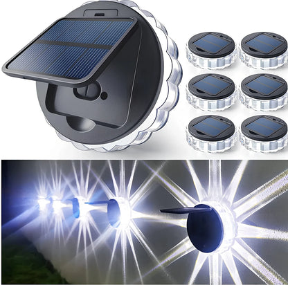 Round solar garden wall light with 9 LED lights mounted on wooden fence