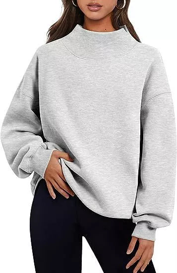Women's solid color pullover sweatshirt with round neck and loose fit